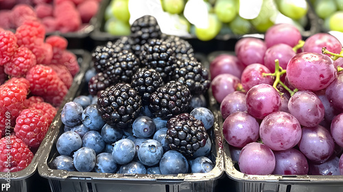 Wallpaper Mural Closeup of an assortment of fresh ripe blackberries blueberries and purple grapes arranged. Torontodigital.ca