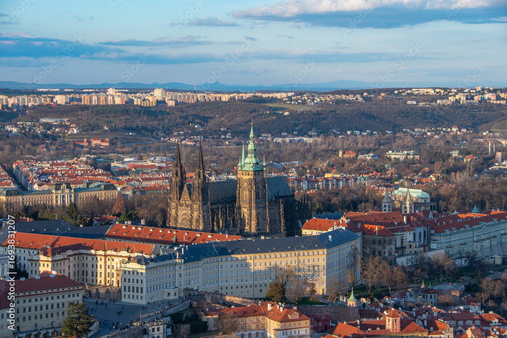 Obraz premium The view from the Petrin lookout tower to the Prague Castle and St. Vitus Cathedral