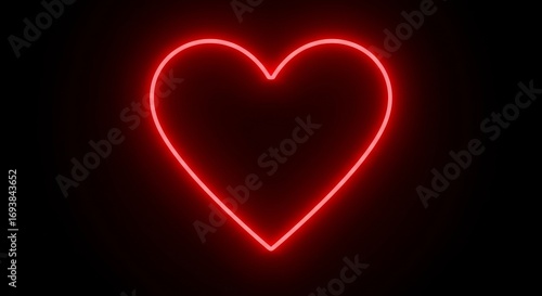 Glowing red neon heart on black background