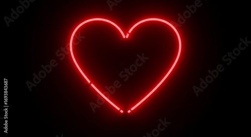 Glowing red neon heart on black background - symbol of love and romance