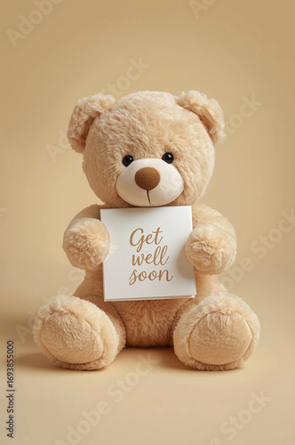 Teddy bear holding “Get well soon” card — heartwarming get well greeting photo