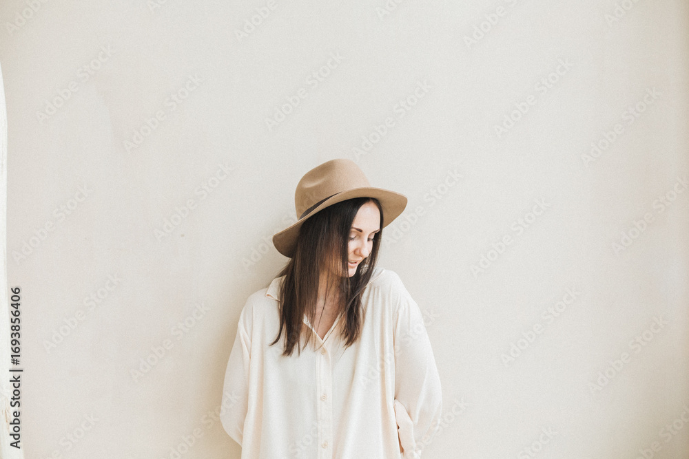 Portrait of Woman with Hat in Minimalist Setting Portrait of Woman with Hat in Minimalist Setting