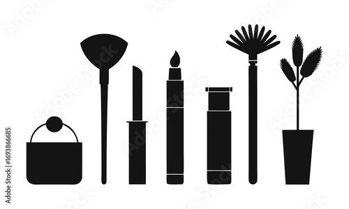 A collection of black silhouette cosmetic makeup brushes and tools including a lipstick and a small potted plant on a white background