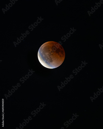 Aerial view of a blood moon with vibrant umbral hues against the inky sky, observed on a cloudless night., Chania, Chania, Greece.