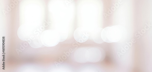 Blurred interior view with soft light and indistinct shapes creating an abstract effect, blending gently into a dreamy airy ambience filled with serene calmness.