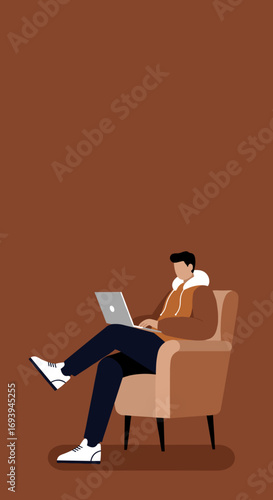 Young man working remotely on a laptop from a comfortable armchair. Ideal for concepts of freelance work, online learning, or casual lifestyle.