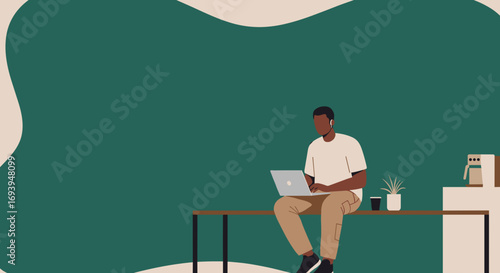 Young man in a modern, minimalist setting, focused on his laptop. Depicts remote work, productivity, freelance, and contemporary lifestyle.