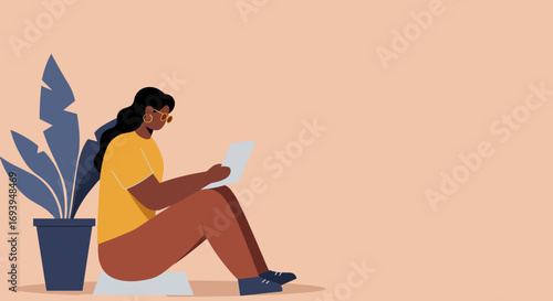 Woman comfortably using a laptop at home, representing remote work, online learning, or digital lifestyle with focus and connectivity.