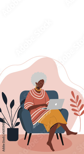Senior African American woman comfortably using a laptop at home, embracing technology for leisure, remote work, or staying connected.
