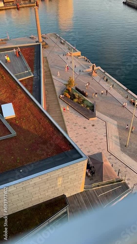 A tranquil sunset reflects over a serene marina, ideal for peaceful vibes and beautiful waterfront scenery, Helsingborg, Sweden