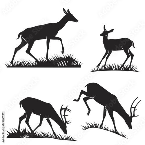 Four black deer and antelope silhouettes grazing and walking grass