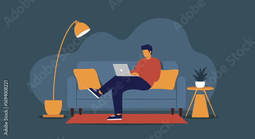 Man focused on his laptop while sitting comfortably on a sofa at home. Represents remote work, online learning, or digital lifestyle concepts.