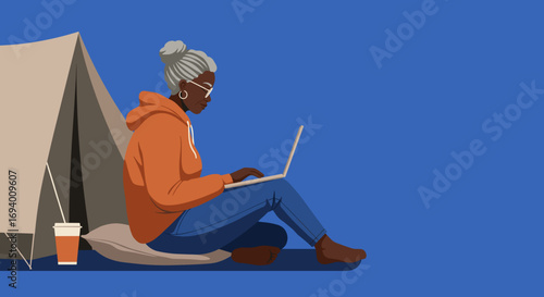 An older Black woman comfortably works on a laptop next to a camping tent, enjoying remote work or leisure travel. Represents digital nomad lifestyle and connectivity.
