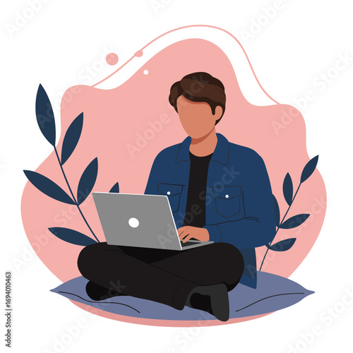 Young man working remotely on a laptop, sitting comfortably on a cushion. Ideal for concepts of freelance, online education, or modern digital lifestyle.