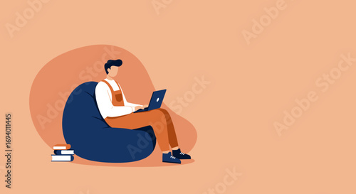 Young man comfortably working on laptop while sitting on a bean bag chair at home. Ideal for remote work, online learning, or casual lifestyle concepts.
