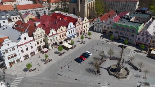 Panning aerial drone shot revealing the Marian Plague Column situated in the historic Havlickovo Square, Havlickuv Brod, Vysocina, Czech Republic.