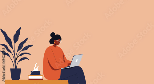 Woman in glasses working on a laptop at home, surrounded by a plant and a warm drink. Represents remote work, freelance, online learning, or a relaxed professional lifestyle.