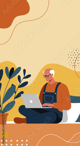 Senior man in overalls using a laptop at home, embracing technology and a modern lifestyle. Represents remote work, online learning, or leisure.