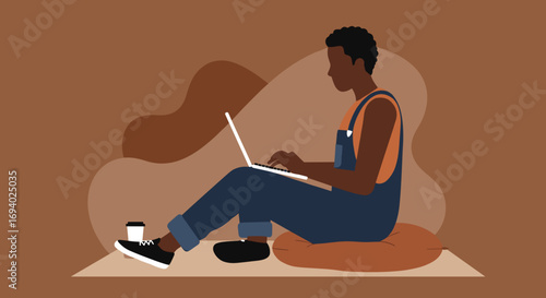 Person in casual wear focused on a laptop with a coffee cup, embodying remote work, online learning, or a digital nomad lifestyle.