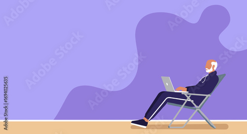 Relaxed older man using a laptop while sitting in a folding chair, representing remote work, digital lifestyle, and modern leisure.