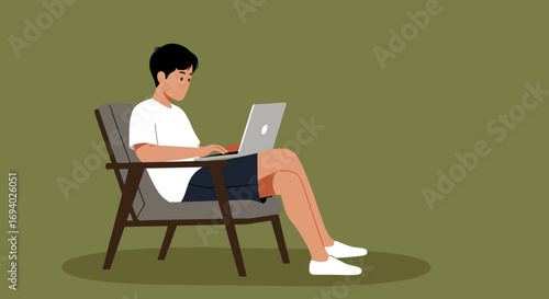Casual young man focused on his laptop while sitting comfortably. Illustrates remote work, freelancing, or digital learning concepts.