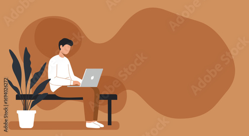 Focused man casually works on his laptop, sitting on a bench next to a houseplant. Concept of remote work, productivity, study, or digital lifestyle.