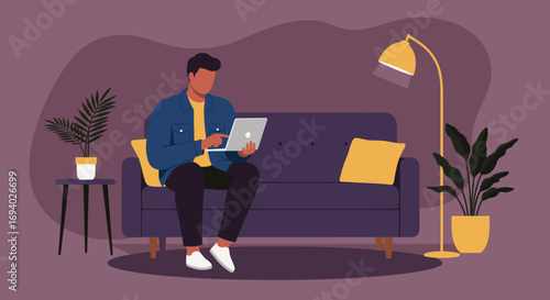 Young man working remotely on laptop at home. Modern casual lifestyle, telecommuting, online business, education, or freelance concept.