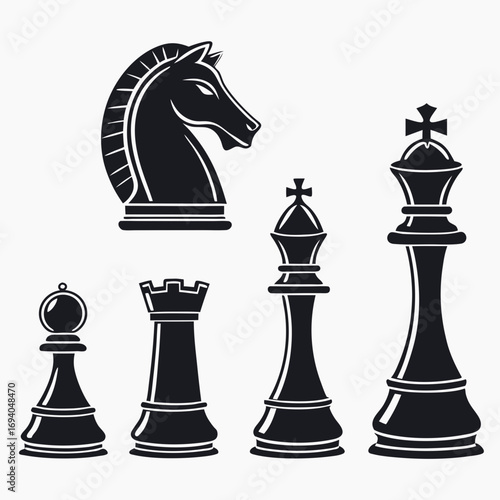 Black chess pieces silhouettes on white background