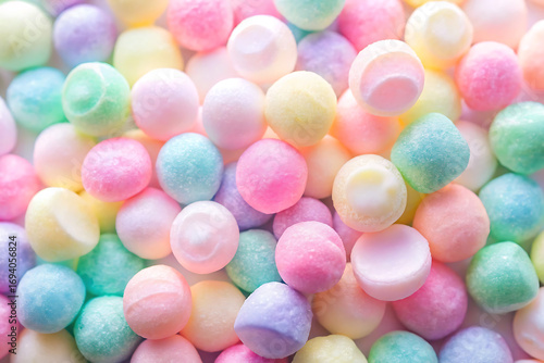 A delightful array of pastel candy drops, a sweet symphony of colors and flavors, creating a visually appealing and tempting confectionery experience