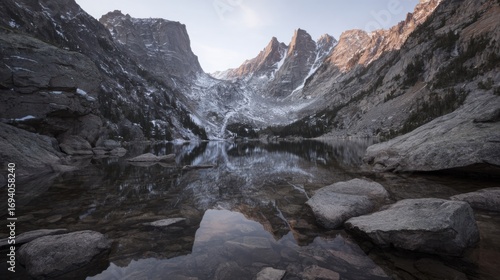 Wallpaper Mural Serene mountain landscape featuring a reflective lake under natural ambient lighting. Torontodigital.ca