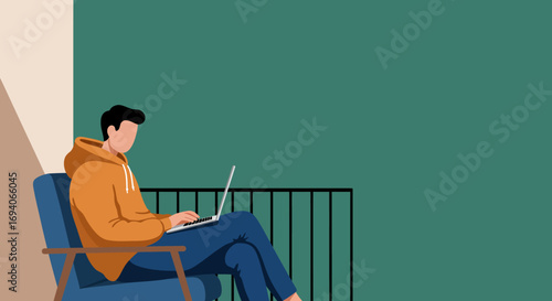 Young man working remotely on a laptop in a comfortable chair at home. Ideal for concepts of distance learning, freelance, and online work.