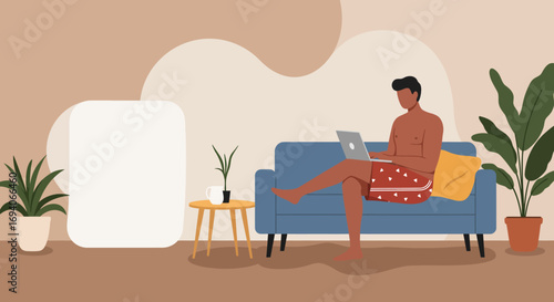 Man working remotely from his home sofa with a laptop, embodying a relaxed yet productive modern lifestyle and flexible work environment.
