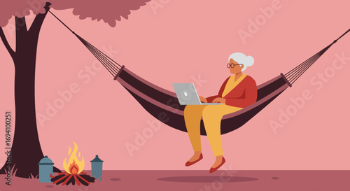 A senior woman enjoys working remotely on her laptop while relaxing in a hammock by a campfire under a tree, illustrating modern retirement and flexible lifestyles.