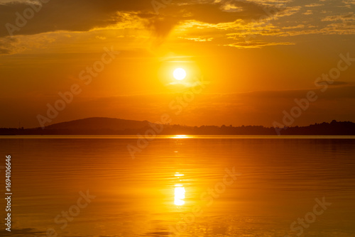 Fototapeta Naklejka Na Ścianę i Meble -  Bright, colorful summer sunset over Lake Mitkow in Poland. Evening landscape.