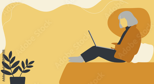 Mature woman comfortably working or browsing on a laptop from home. Represents remote work, online learning, or digital lifestyle for seniors.