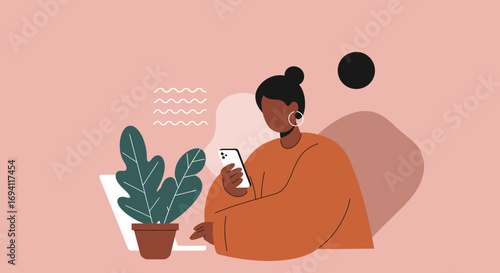 A diverse person is actively engaged with a smartphone and laptop in a modern, minimalist setting, symbolizing digital communication, remote work, or online leisure.