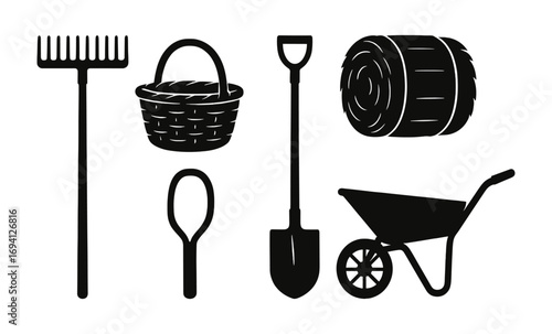 Farm tools silhouette on rustic wooden background