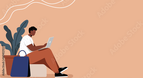 Young man working remotely on a laptop at home, embracing modern freelance lifestyle. Ideal for technology, online business, or casual work concepts.