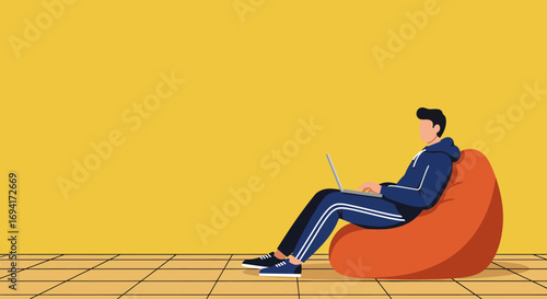 Man comfortably working from home on a laptop, sitting on a bean bag chair. Depicts remote work, online education, or casual digital lifestyle.
