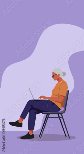 Focused senior woman with glasses working intently on her laptop, embodying digital literacy and modern retirement lifestyle.