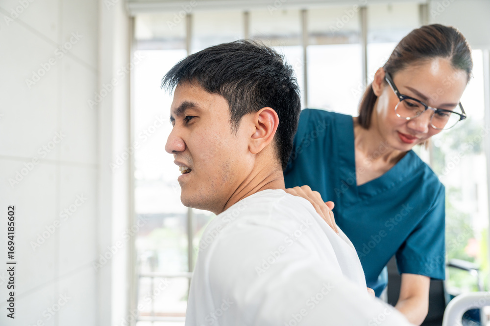 Obraz premium Physical therapy. Female Nurse aids young man in recovering from spine injury and providing orthopedic massage Orthopedic healthcare and chiropractor with person for physical therapy rehabilitation