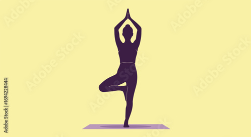 Silhouette of woman in tree pose showcasing balance and strength on a mat with a serene yellow background, ideal for wellness visuals