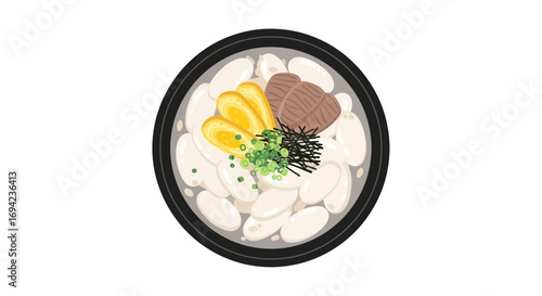 Delicious Korean rice cake soup (Tteokguk) garnished with egg and meat