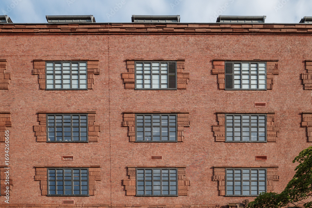 Fototapeta premium A straight-on photograph of the historic facade of the Ullsteinhaus building in the Tempelhof district of Berlin, Germany.