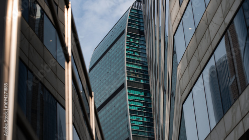 walls and empty windows of a modern building on a big city street without people