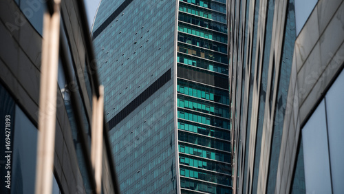 walls and empty windows of a modern building on a big city street without people