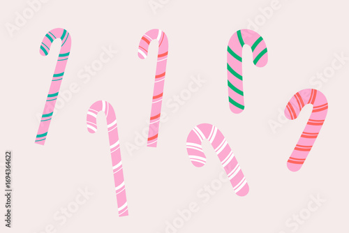 Pink christmas candy canes set with festive striped decoration
