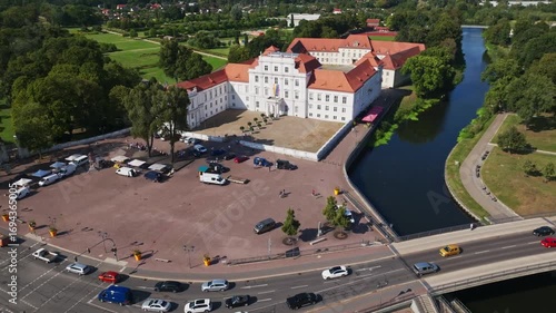 Aerial drone view of Oranienburg Palace (Schlossmuseum Oranienburg), historic baroque landmark and museum surrounded by gardens in Oranienburg, Brandenburg, Germany. 15 September 2024