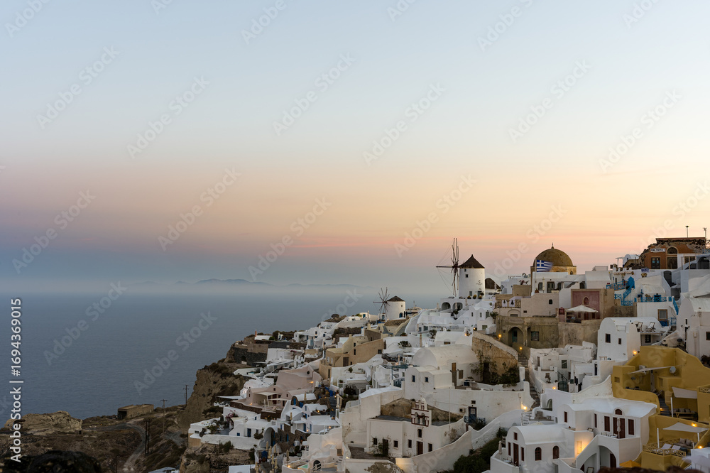 Fototapeta premium Santorini Oia Village with Windmills at Sunset
