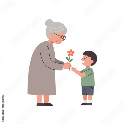 Grandmother receiving a flower from a boy.